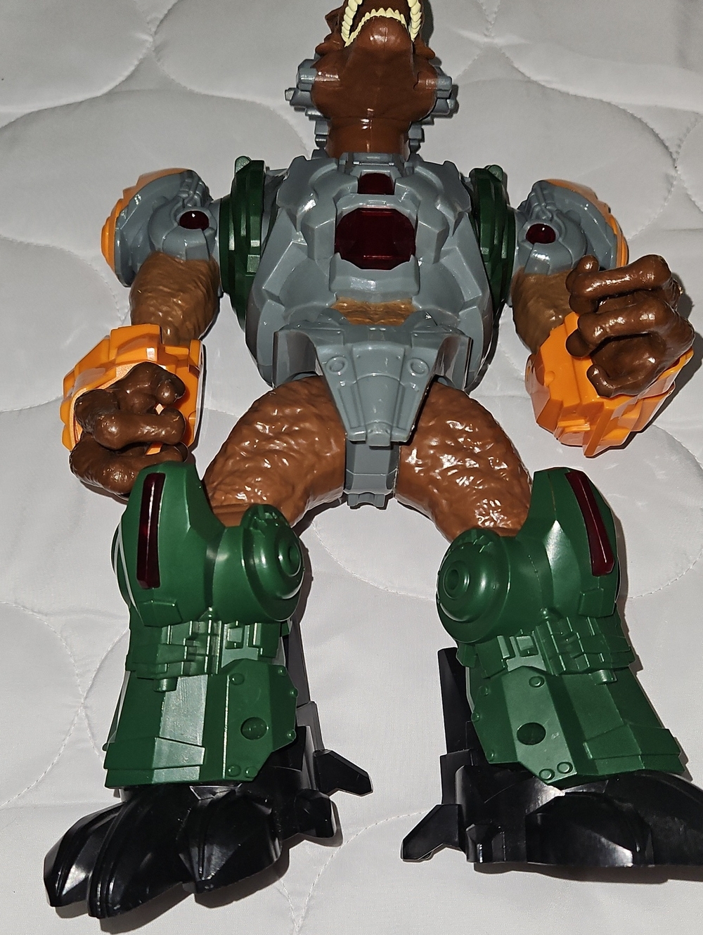 Brown and Green Action Figure Toy with Orange Accents